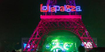 A replica of the Eiffel Tower with the festival logo stands on the grounds of the French edition of Lollapalooza, held in Paris.