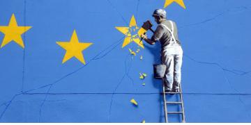 Banksy Brexit mural of man chipping away at EU flag in Dover