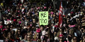 A Women's March protester holds up a MeToo sign